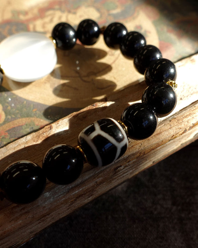 Tibetan Black Onyx Bracelet with Jambhala Buddha Eye & Turtle-Back Longevity Bead