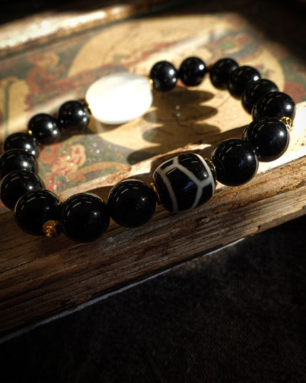Tibetan Black Onyx Bracelet with Jambhala Buddha Eye & Turtle-Back Longevity Bead