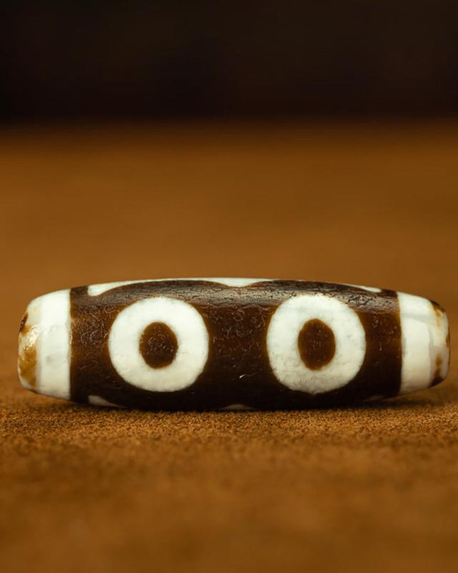 Triple-Eye Dzi Pendant – Prosperity and Energy Talisman