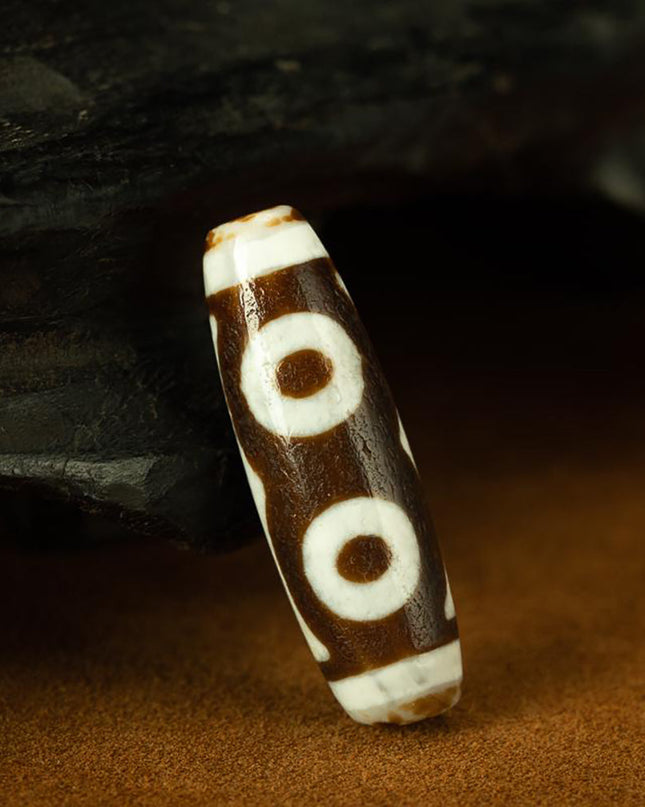 Triple-Eye Dzi Pendant – Prosperity and Energy Talisman