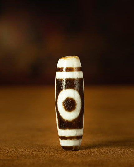 Triple-Eye Dzi Pendant – Prosperity and Energy Talisman