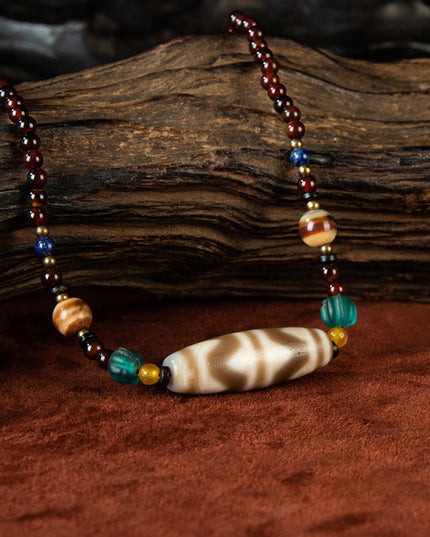 Nine-Eye Tiger Tooth Dzi Pendant – Courage Energy and Spiritual Empowerment