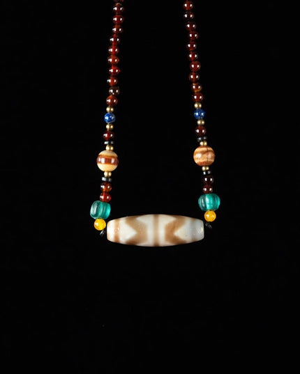 Nine-Eye Tiger Tooth Dzi Pendant – Courage Energy and Spiritual Empowerment