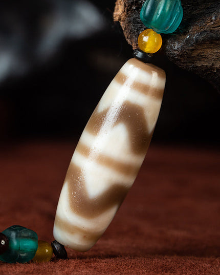 Nine-Eye Tiger Tooth Dzi Pendant – Courage Energy and Spiritual Empowerment